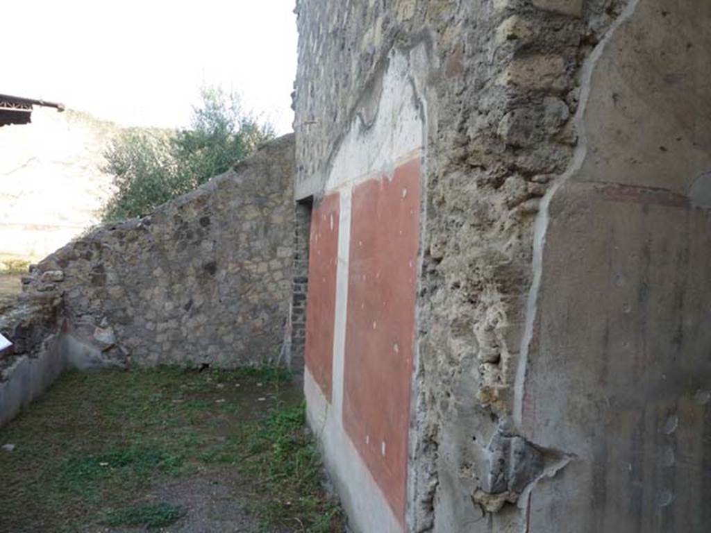 Oplontis, September 2015. Room 57, looking east along painted south wall to doorway leading to room 55.