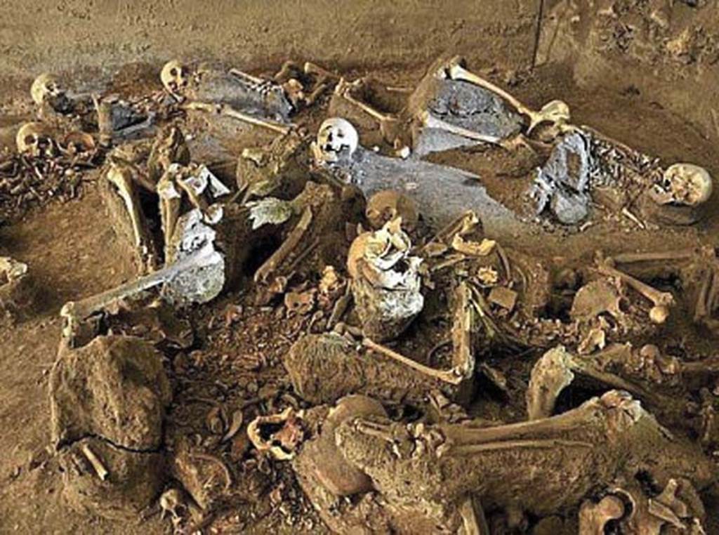 Oplontis, Villa of Lucius Crassius Tertius. In October 1984, in room 10, 54 skeletons were found. 
According to the Oplontis Project web site, the most important find, and one that—properly studied—can shed light on pressing questions, is the discovery of the skeletons of 54 individuals in room 10, one of the large ground-floor rooms that opened onto the southern portico).  These were people who had gathered in this room to escape the eruption, and presumably to await rescue from the sea, overcome by the hot gas and poisonous fumes of the first pyroclastic flow that hit Villa B.  They are a gruesome reminder of the human toll taken by Vesuvius.  Because they were found in two distinct groups, some scholars attempt to distinguish the skeletons in terms of social status.  Those at the rear of the space, bearing no money or jewellery, would be said to be servants and slaves, whereas the group near the entrance to the space would be elites—this because some of them were found with considerable wealth in the form of coins and jewellery.
See Oplontis Project Villa B
