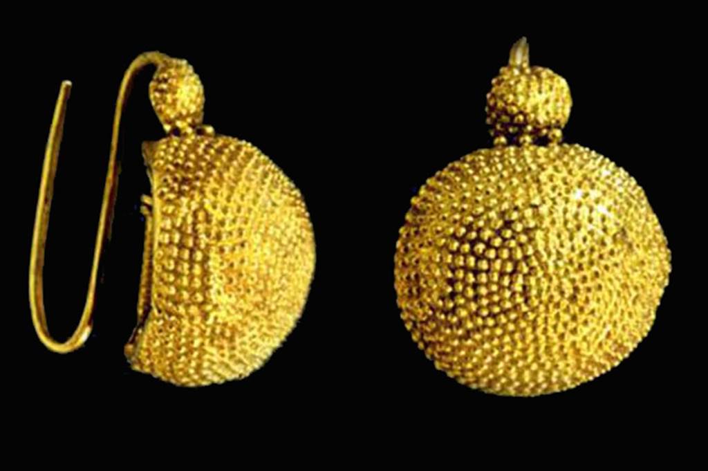 Oplontis, Villa of Lucius Crassius Tertius. Pair of spherical segment gold ear rings. 
According to D’Ambrosio, the body is decorated with close-embossed dotting imitating the more refined technique of granulation.
SAP inventory number 72996.
See D’Ambrosio, A., 2001. Women and Beauty in Pompeii. Roma: Bretschneider, p. 52, fig. 7.
