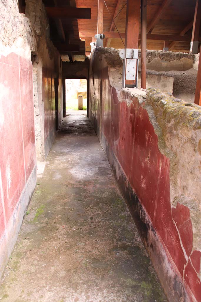 Stabiae, Villa Arianna, October 2020. 
W27, looking east along corridor towards large peristyle, from lightyard, ramp and rustic area. Photo courtesy of Klaus Heese.
