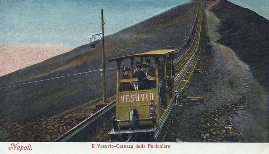 Vesuvius Funicular car Vesuvio. Undated colour postcard but must be between 1889 and 1904.
This is the second of two new cars, with seating for 10 people, introduced in 1889 as part of renovations by John Mason Cook.