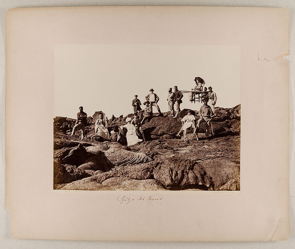 Vesuvius, about 1880. A family and their guides on the lava. 
Photo title at bottom is “8129 Vesuvio - Cratere. G. Sommer – Napoli”. 
The handwritten note says “Spitze des Vesuv”.
Museum für Kunst und Gewerbe Hamburg, inventory number P1981.398 (Public Domain).
See https://sammlungonline.mkg-hamburg.de/de/object/8129-Vesuvio---Cratere/P1981.398/mkg-e00135740
