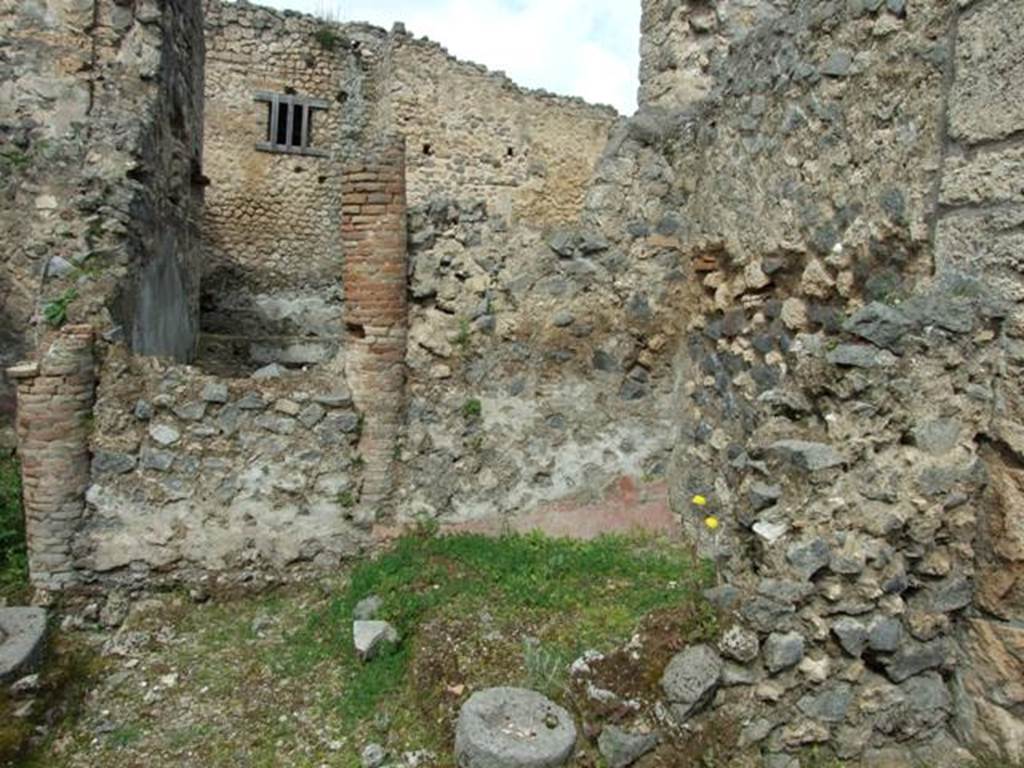 I.9.12 Pompeii. March 2009. Room 9. Looking north, showing bricked up peristyle columns, and towards rear yard, of 1.9.11