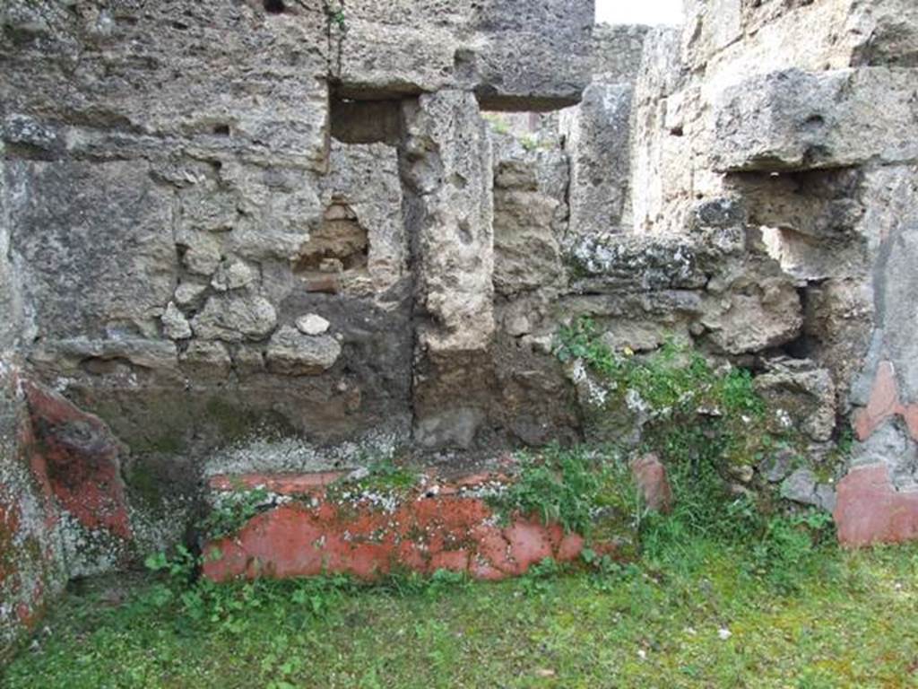 I.9.12 Pompeii. March 2009. Room 9. West wall, with remains of painted plaster.