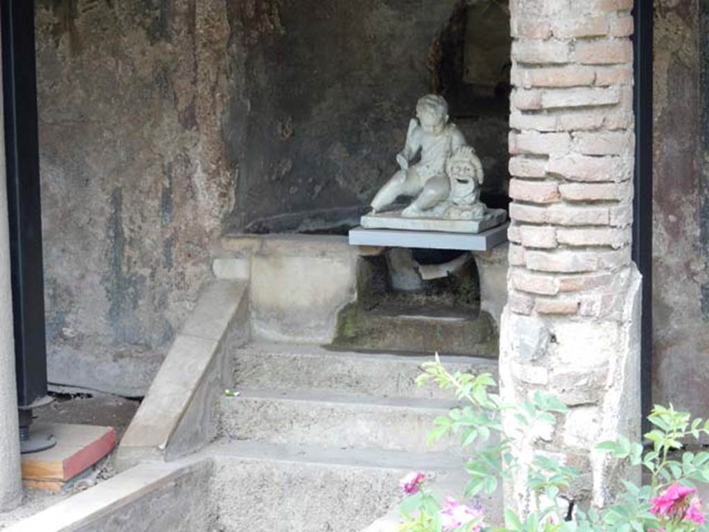 II.2.2 Pompeii. Mary 2016. Room “l”, garden.
Lower level of nymphaeum with white statuette of a cupid with a mask found above the steps in 1920.
Photo courtesy of Buzz Ferebee.