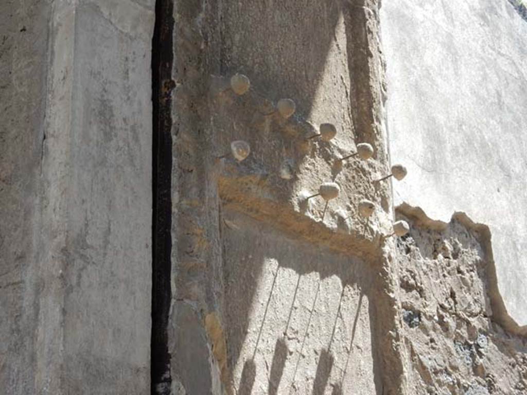 II.2.2 Pompeii. May 2016. Detail from plaster cast of doorway shutter on east side.
The shutter was decorated with protruding studs of bronze and iron. Photo courtesy of Buzz Ferebee.