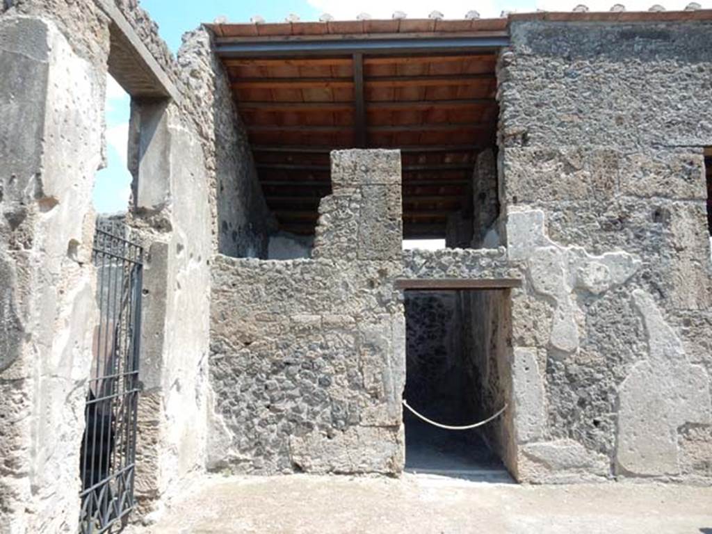 II.2.2 Pompeii. May 2016. Room 2, north-east corner of atrium, with doorway to II.2.3, and doorway to room 3 in centre.
Photo courtesy of Buzz Ferebee.