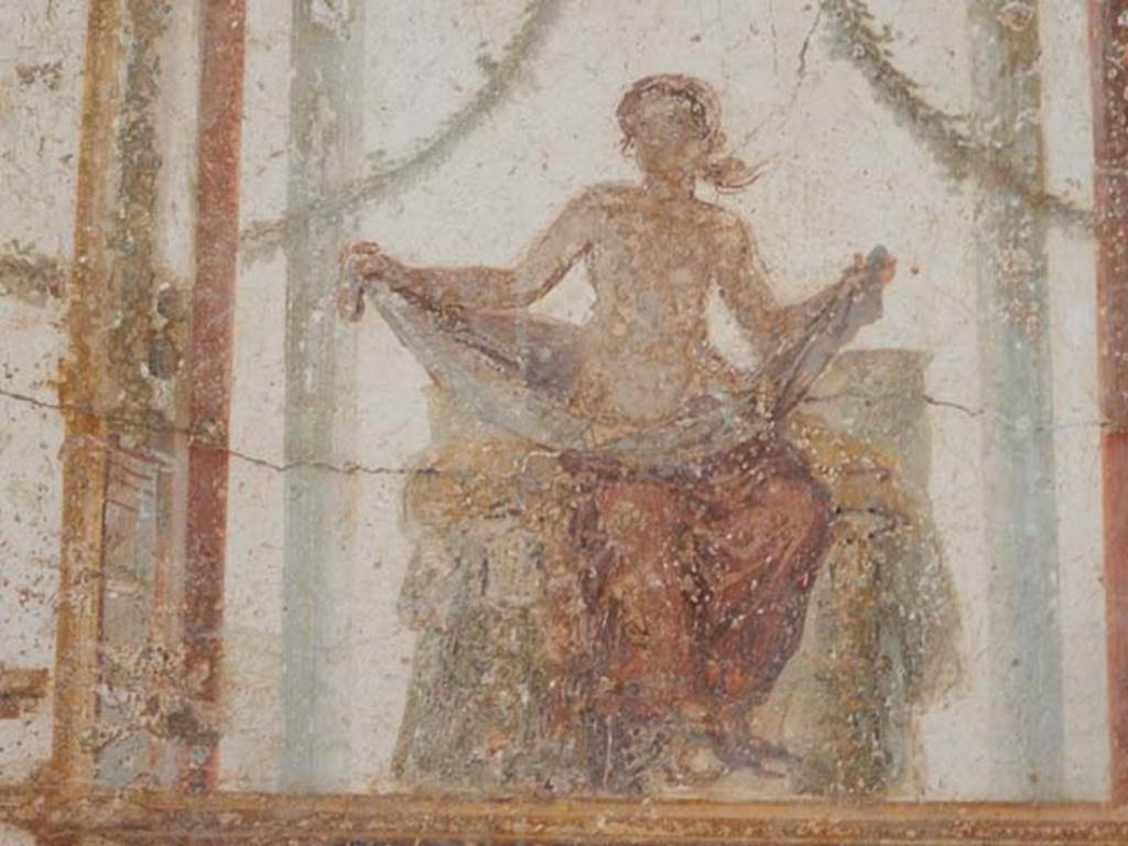 II.2.2 Pompeii. May 2016. Room “f”, detail of painted figure from centre of upper west wall.
Photo courtesy of Buzz Ferebee.