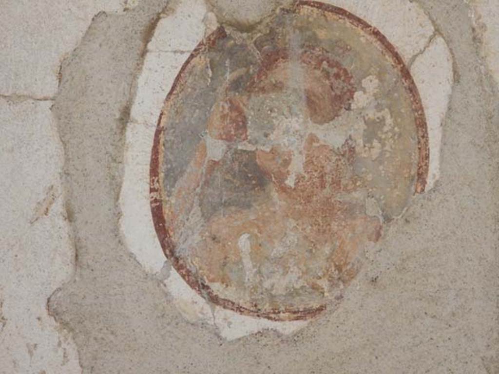 II.2.2 Pompeii. May 2016. Room “f”, medallion from centre of panel at north end of west wall. Photo courtesy of Buzz Ferebee.