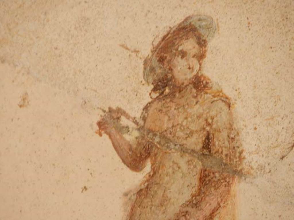 II.2.2 Pompeii. May 2016. Room “f”, detail of painted figure from panel at west end of north wall.
Photo courtesy of Buzz Ferebee.