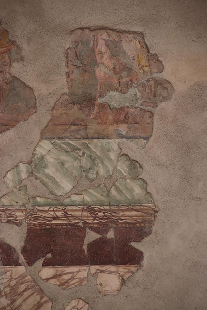 II.2 2 Pompeii. October 2023.
Room “h”, north wall of triclinium lower frieze, detail of Automedon (Achilles' charioteer) readying Achilles' chariot.
Photo courtesy of Klaus Heese.