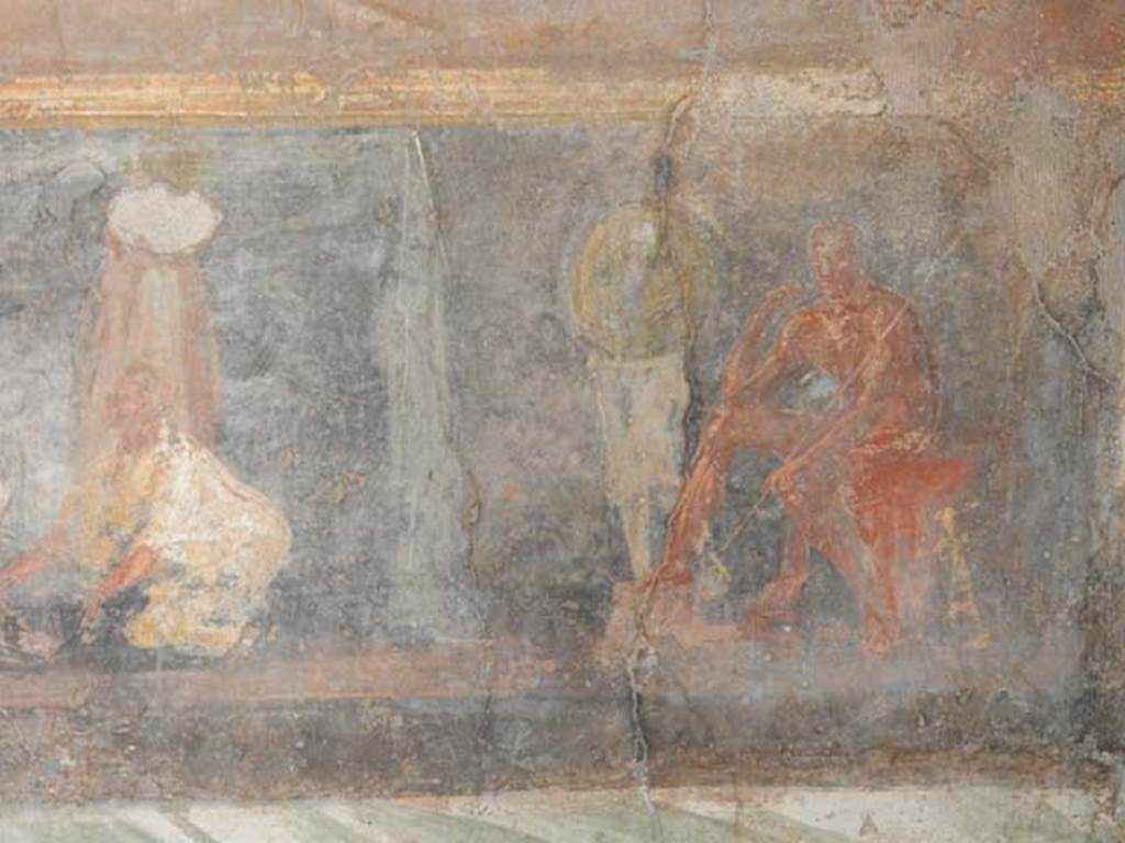 II.2.2 Pompeii. May 2016. Room “h”, south end of east wall.
In his tent a naked Achilles sits in thoughtful pose, sceptre in his left hand and his sword leaning against his seat. Patroclus, fully armed, is next to him.
See Lorenz K., 2013. In Epic Visions: Visuality in Greek and Latin Epic and its Reception. Cambridge U.P., p. 235-6.
Photo courtesy of Buzz Ferebee.