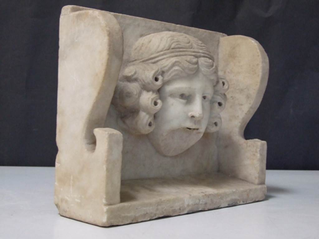 II.2.2 Pompeii. March 2009. Room “i”. White marble Mask of a woman. Found on the south side of the upper euripus in the garden in 1920. SAP inventory number: 2928.