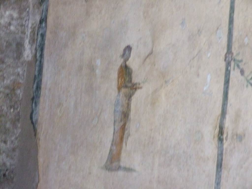 V.5.3 Pompeii. March 2009. Room 6, wall painting of female figure on north end of middle panel of east wall of triclinium.
