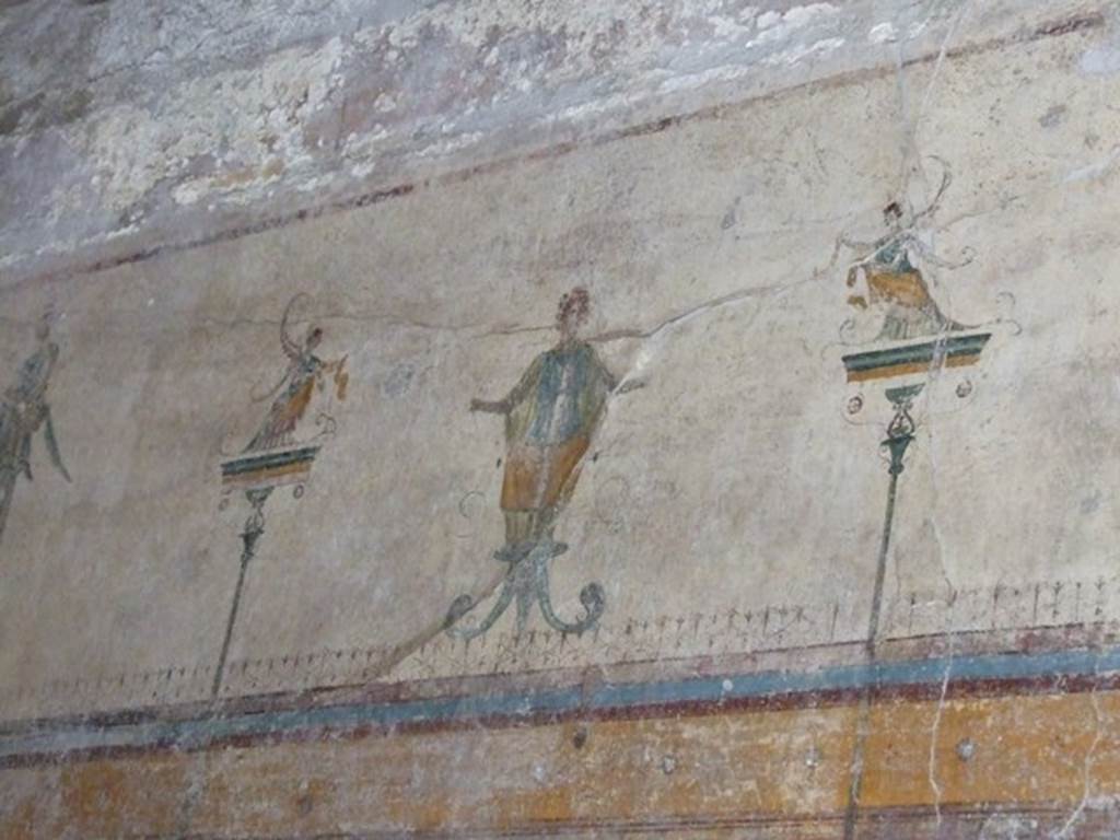 V.5.3 Pompeii. March 2009. Room 6, wall painting of figures on centre of upper part of east wall at the north end of triclinium.