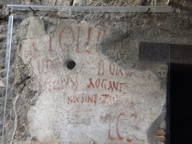 IX.11.2 Pompeii. December 2006. Graffiti on west side of entrance.  
Below the graffito CIL IV 7863, see photo above, would have been CIL IV 7864 on the left. This cannot be seen anymore.  CIL IV 7865 can still be seen, on the right.  
According to Epigraphik-Datenbank Clauss/Slaby (See www.manfredclauss.de), they read as -
C(aium) I(ulium) P(olybium) IIvir(um) i(ure) d(icundo)
[[Zmyrina]] rog(at)           [CIL IV 7864]
L(ucium) C(eium) S(ecundum) IIv(i)r(um)      [CIL IV 7865]
