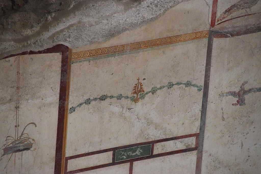 IX.12.9 Pompeii. October 2024. 
Room 13, detail from upper east wall at north end. Photo courtesy of Klaus Heese.
